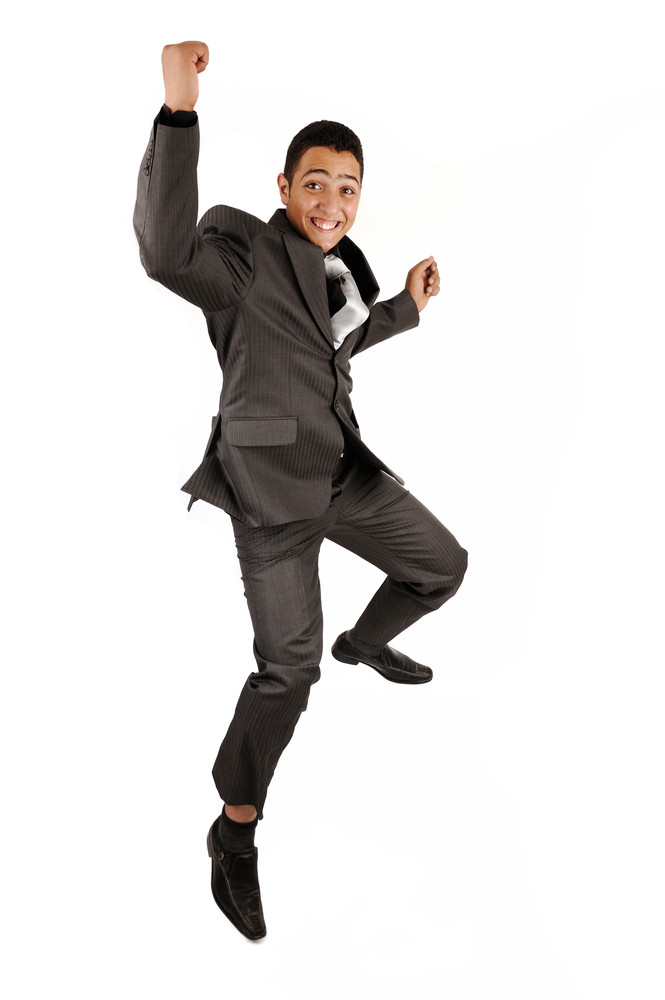 Portrait Of A Happy Businessman Jumping In Air Against Isolated White Background Royalty Free