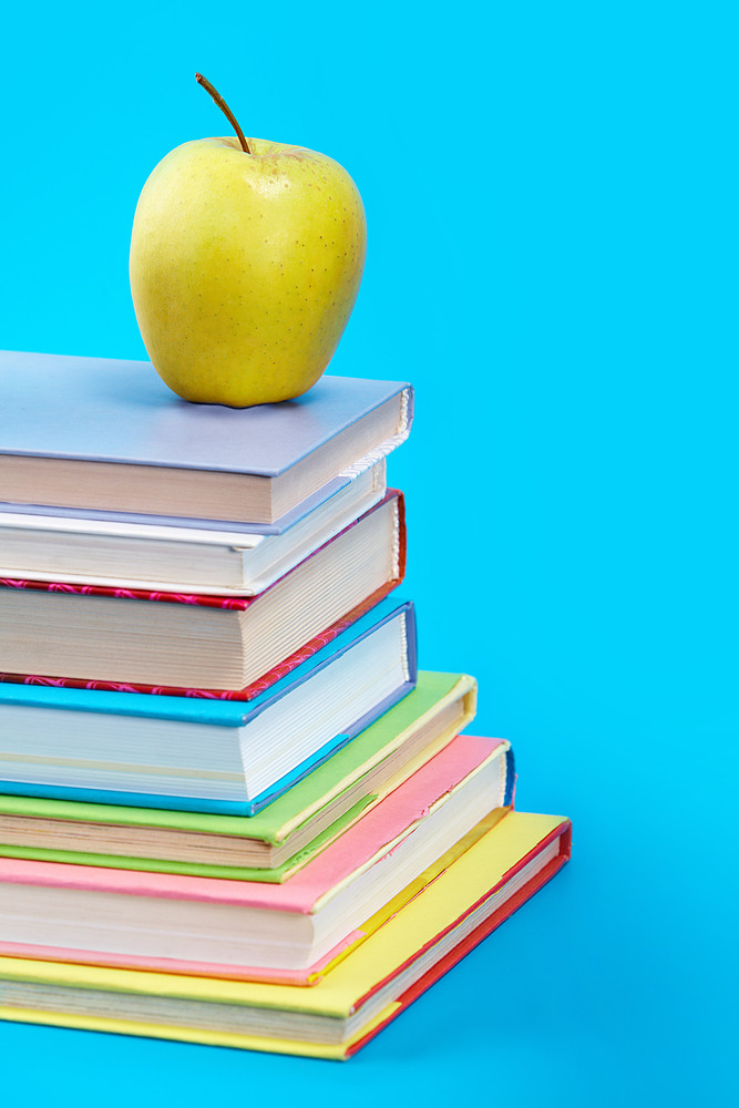 Vertical image of books with green apple Royalty-Free Stock Image ...