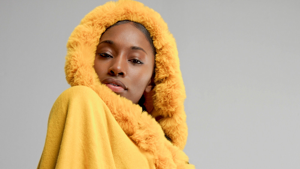 Autumn Look Of Black Mixed Race Woman In Yellow Poncho In Studio