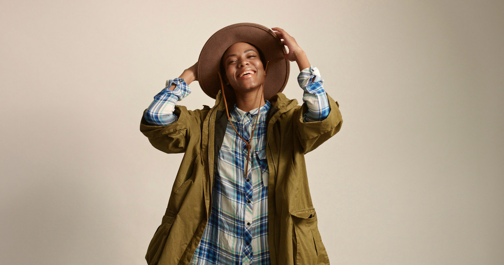 Pretty Mixed Race Woman With Short Hair In Autumn Outwear And Hat