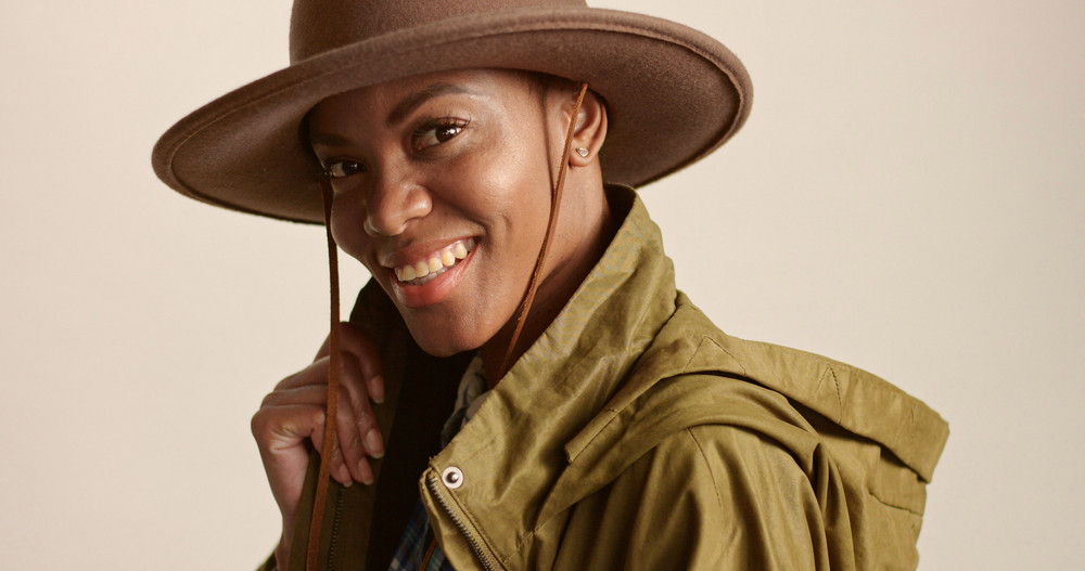 Pretty Mixed Race Woman With Short Hair In Autumn Outwear And Hat