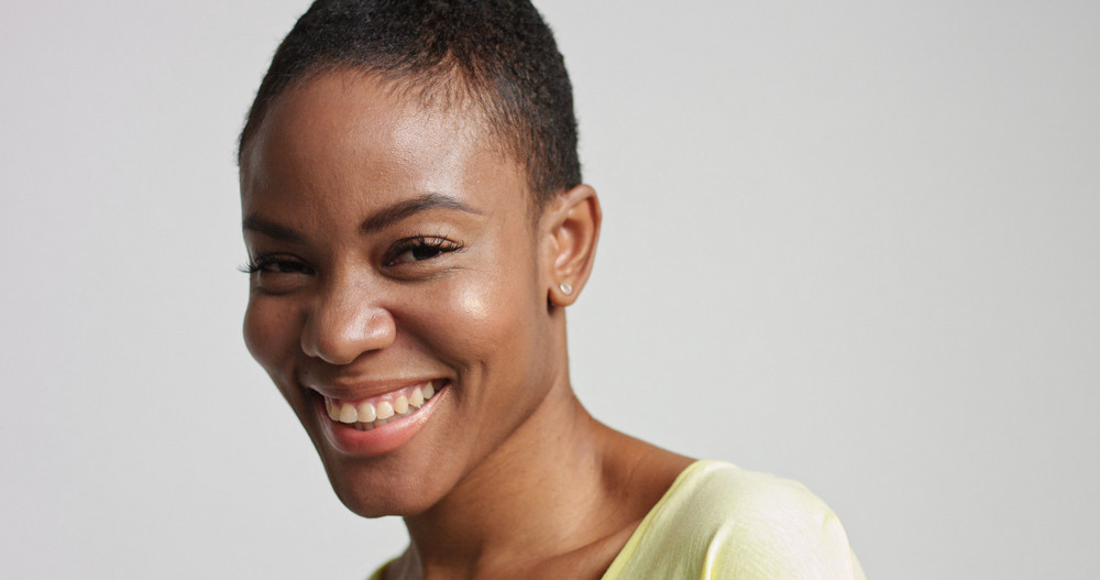 Pretty Mixed Race Woman With Short Hair Laughing Royalty Free