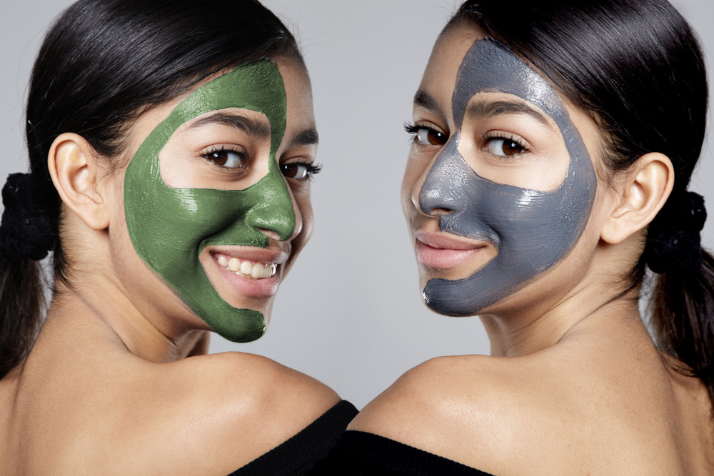 the same woman in double portrait with half of face with facial mask