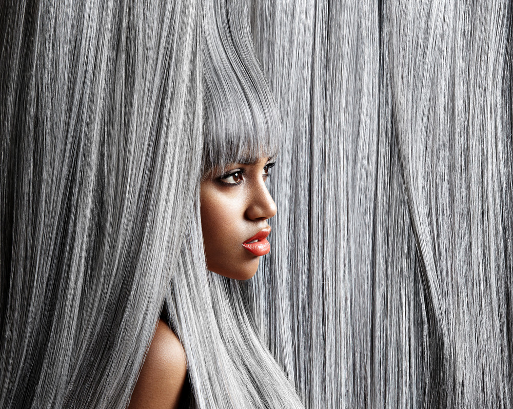 woman\'s profile in trendy grey hair background