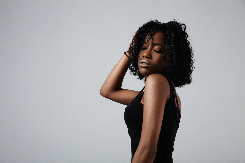 Young Black Mixed Race Woman With Short Curly Hair Stuido Portrit