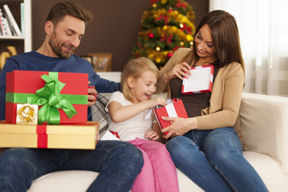 Funny time during opening christmas gifts - Stock Image - Everypixel