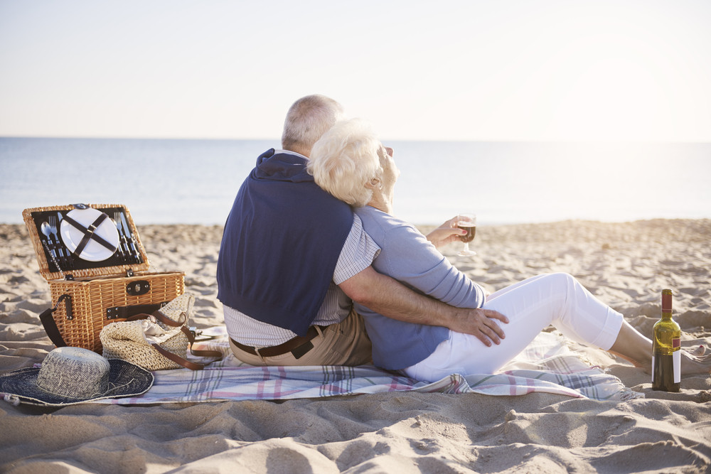 Senior marriage having good morning on the beach