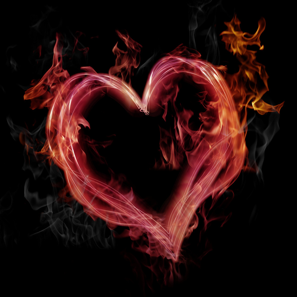 Flaming pink heart on black background