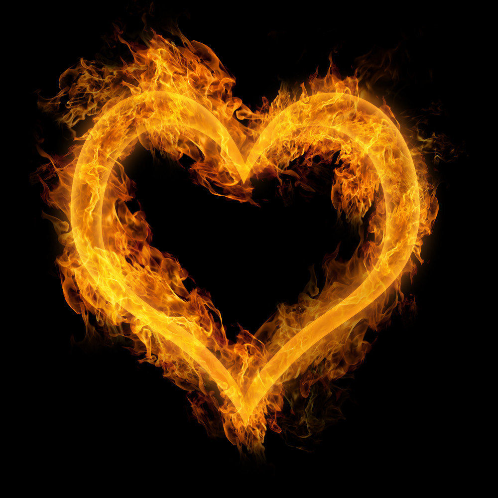 Heart made of fire on black background
