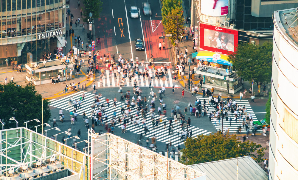 TOKYO, JAPAN - SEP, 25 2017: People cross the famous intersection in Shibuya, Tokyo, Japan one of the busiest crosswalks in the world.