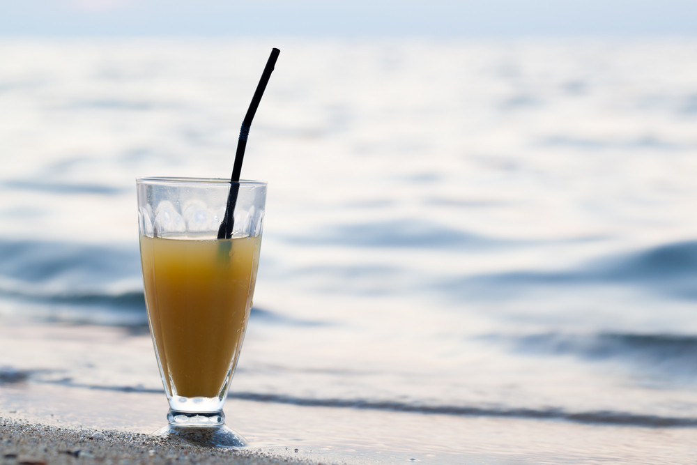 Glass Of Cocktail On Beach Near Water Royalty Free Stock Image Storyblocks