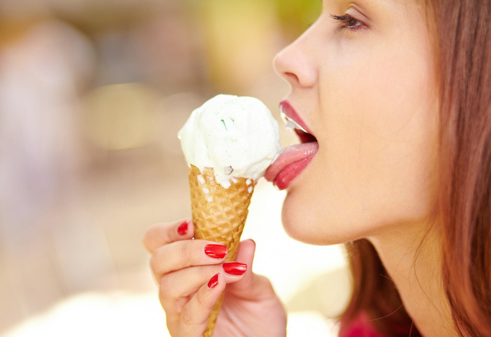 Close-up Of A Pretty Girl Enjoying An Ice-cream Cone Royalty-Free Stock ...