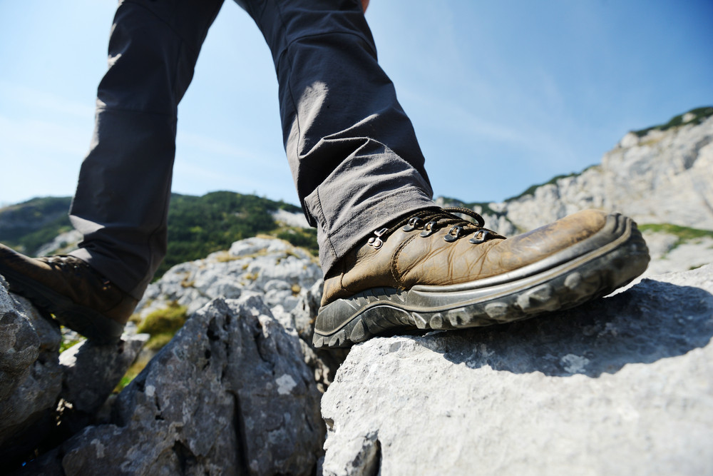 Leg foot standing on rock in mountains Royalty-Free Stock Image ...