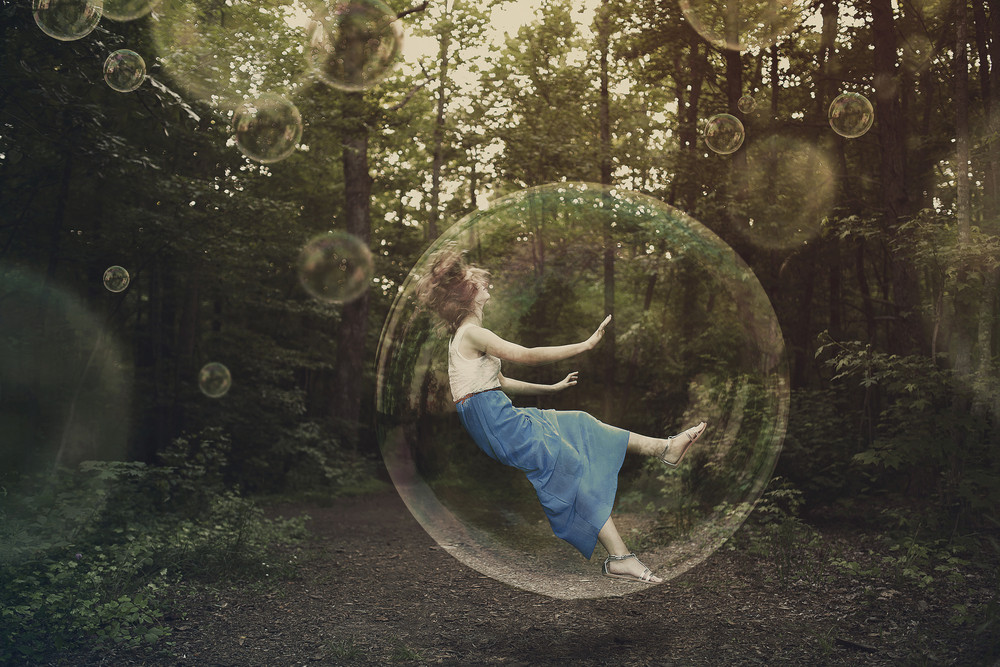 A woman is falling and stuck inside a bubble