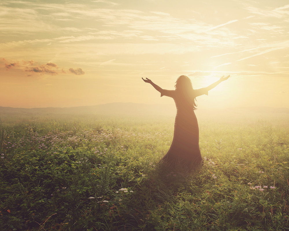 A woman lifts her arms in praise at dawn Royalty-Free Stock Image ...