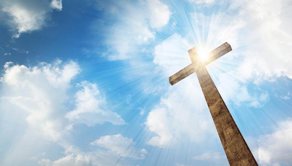A wooden Christian cross with bright sun and clouds. Royalty-Free Stock ...