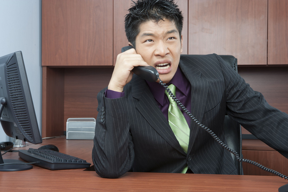 Angry businessman on phone