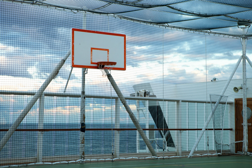 Basketball court and hoop with a view of the Atlantic ocean.