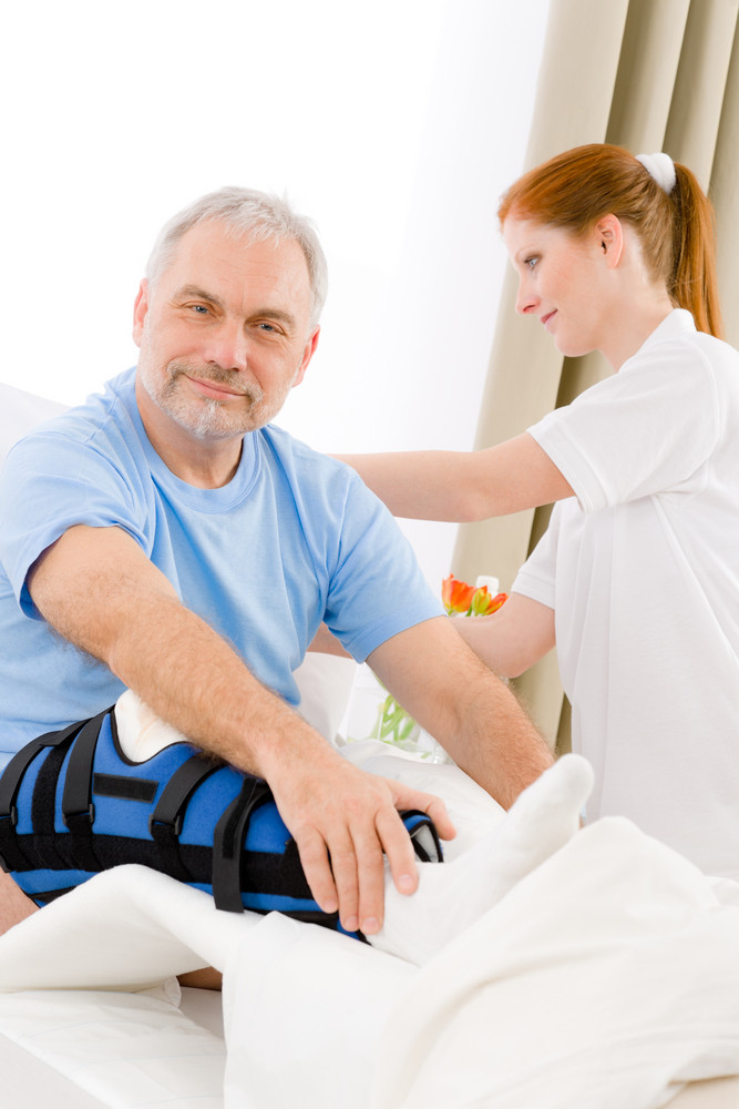 Hospital - female nurse take care of patient with broken leg Royalty ...