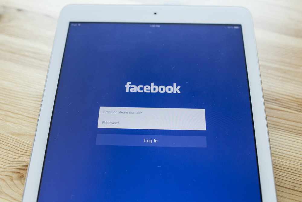 CHIANG MAI, THAILAND - SEPTEMBER 07, 2014: Facebook application sign in page on Apple iPad Air. Facebook is largest and most popular social networking site in the world.