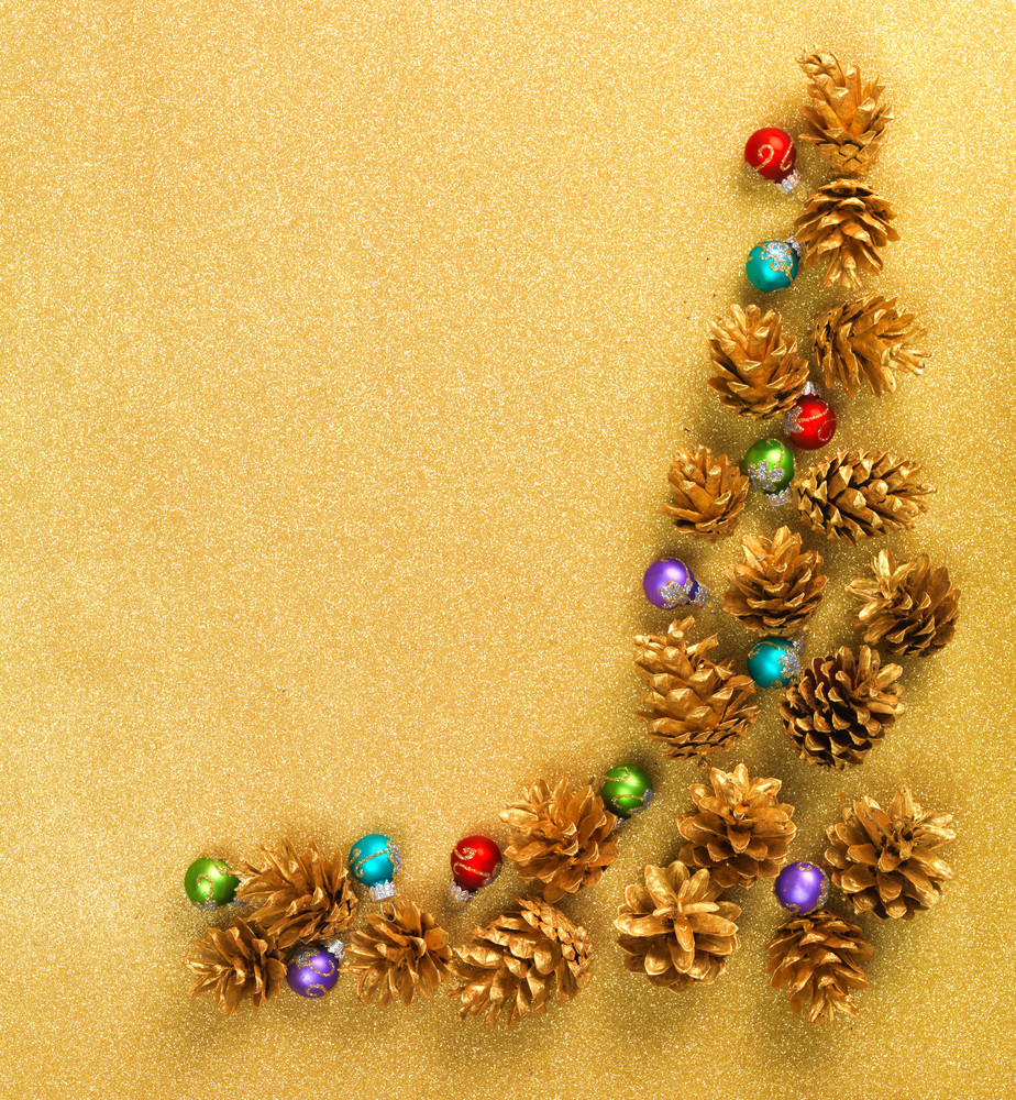 Abstract Christmas gold background with golden holiday balls Royalty