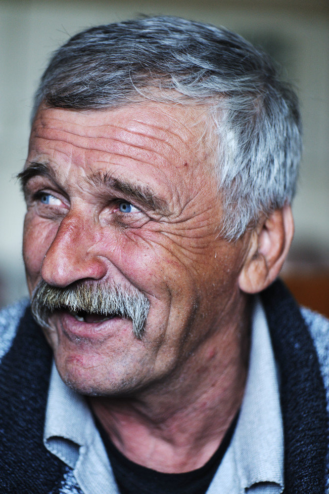 Common elderly positive man with mustache