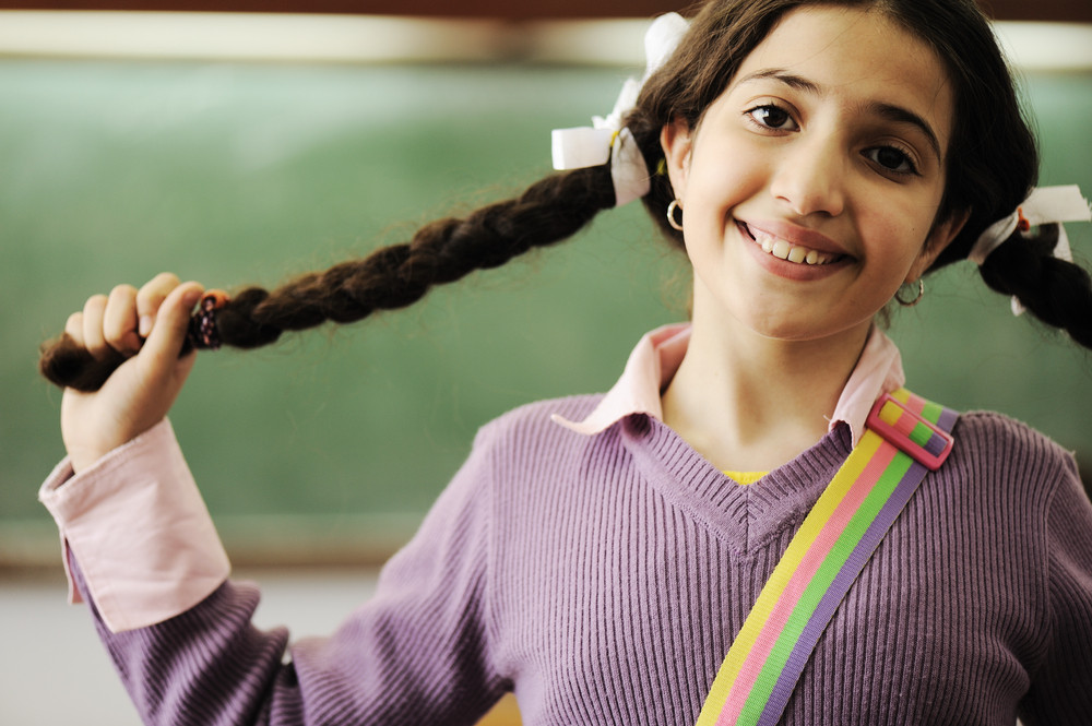 Cute Little Girl With Hair Braids At School Royalty Free Stock