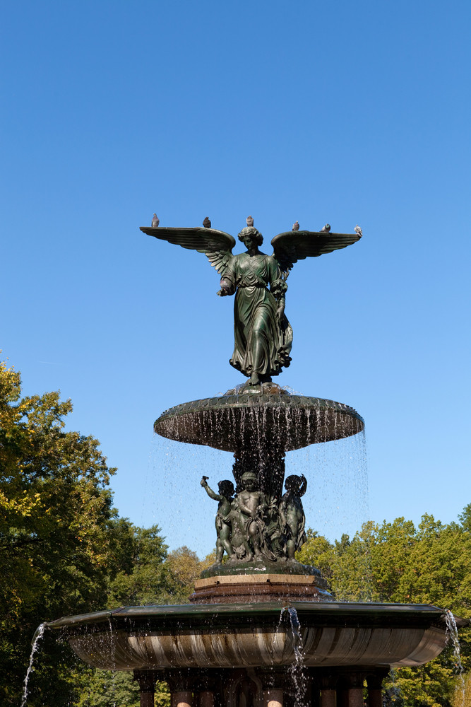 Fountain with an angel statue located in Central Park in New York City ...