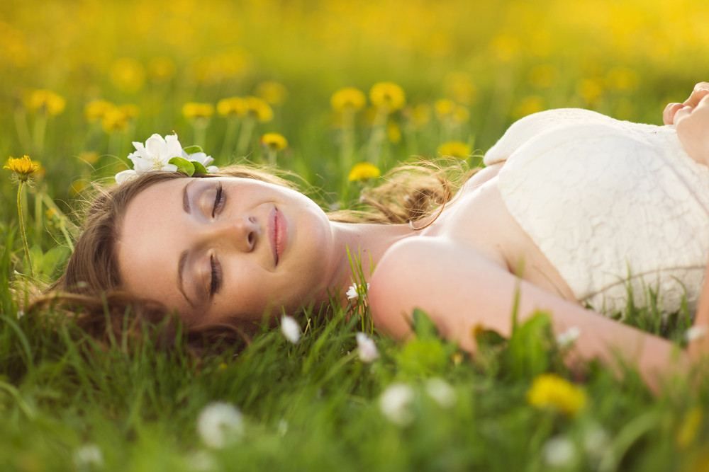 Beautiful Girl Is Relaxing Lying On The Grass In The Garden Royalty Free Stock Image Storyblocks