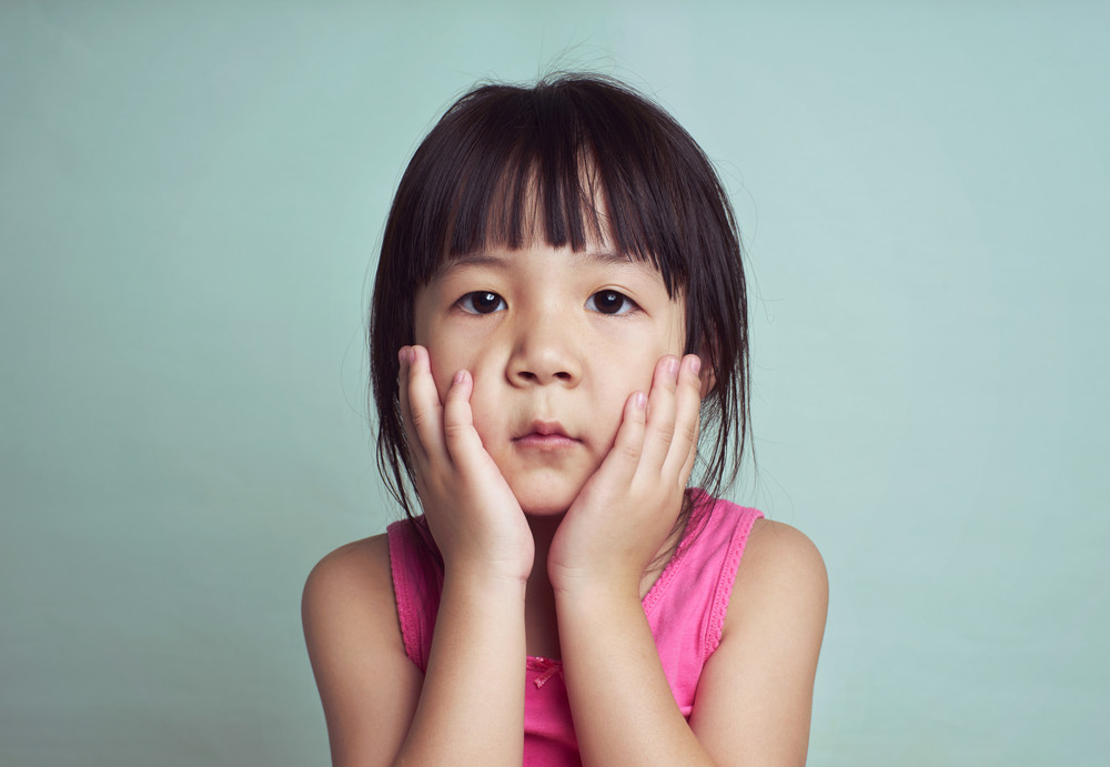 Beautiful girl looking sad with pouted lips. Closeup portrait of cute ...