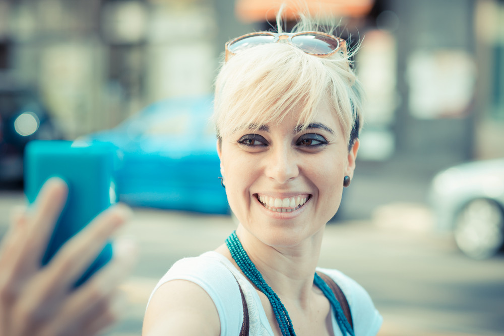 Beautiful Young Blonde Short Hair Hipster Woman Selfie In The City