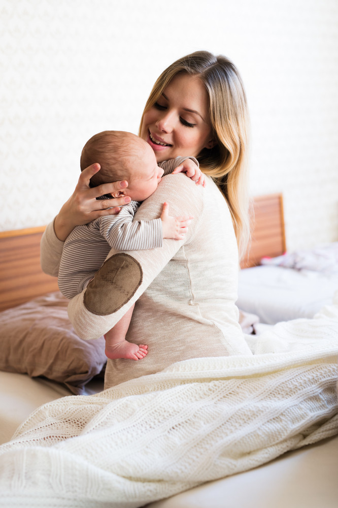 baby holding bed