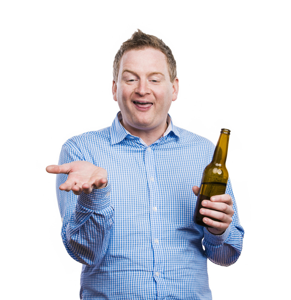 Funny Young Drunk Man Holding A Beer Bottle Studio Shot On White