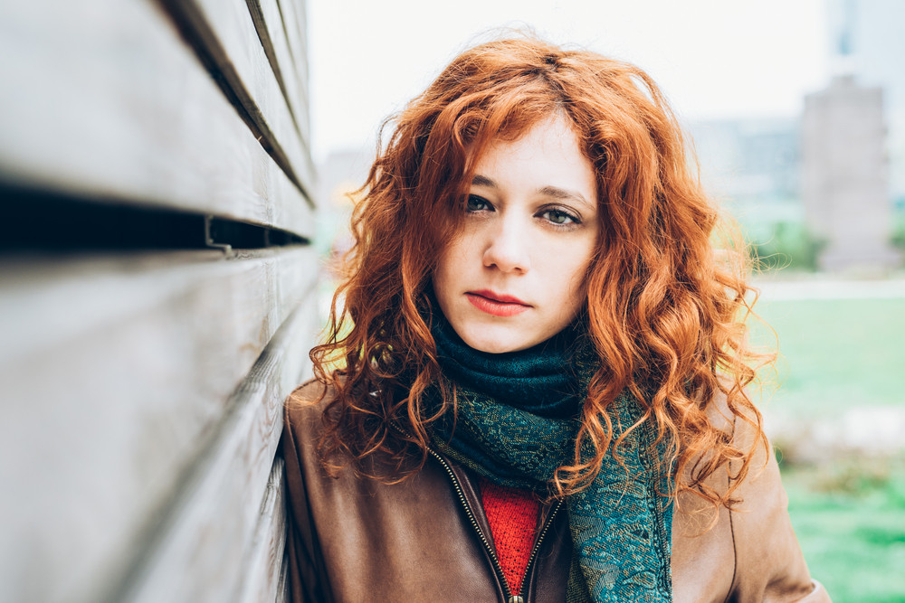 Half Length Portrait Of Young Beautiful Caucasian Redhead Woman Looking 