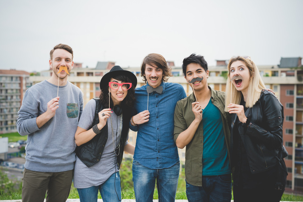 Knee Figure Of Group Of Young Multiethnic Friends Posing Using