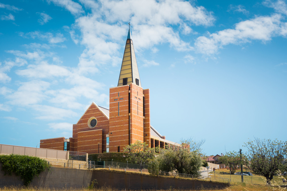 Newly built in 2005 after a tornado demolished the original one St Patrick\'s Catholic Cathedral stands on the hill in Bunbury Western Australia on a cloudy afternoon in late autumn.