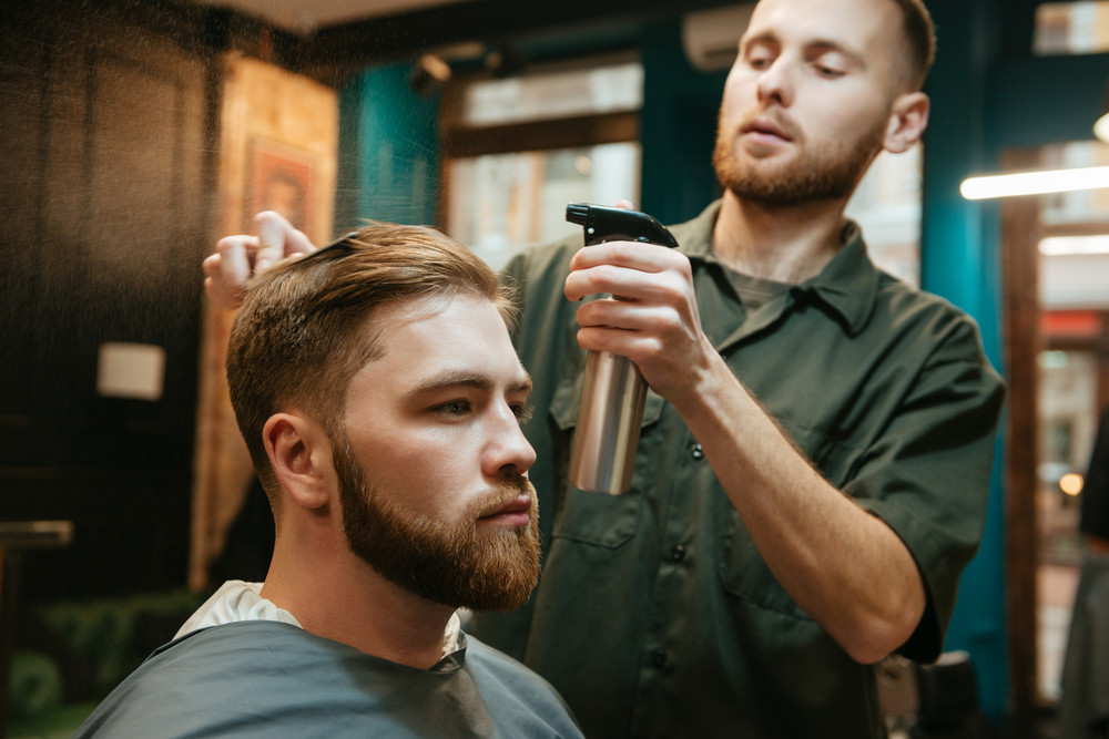 Photo Of Hipster Man Getting Haircut By Hairdresser While Sitting