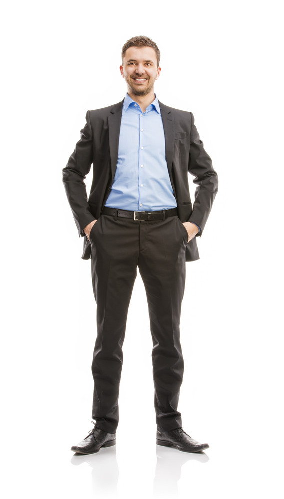 Successful business man in suit is posing in studio isolated over white ...