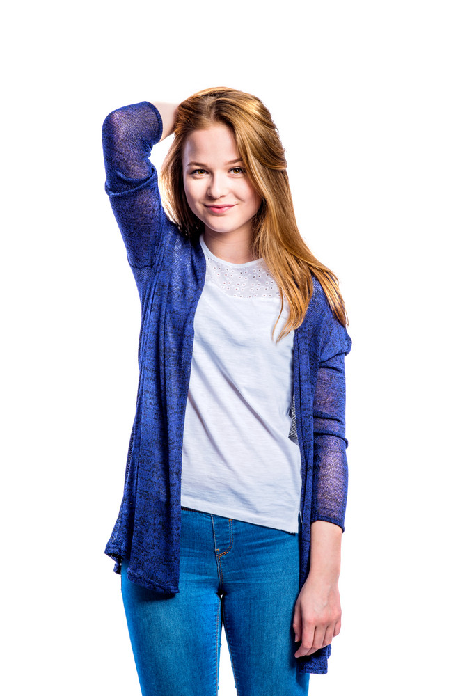 Teenage girl in jeans and long blue sweater, young woman, studio ...