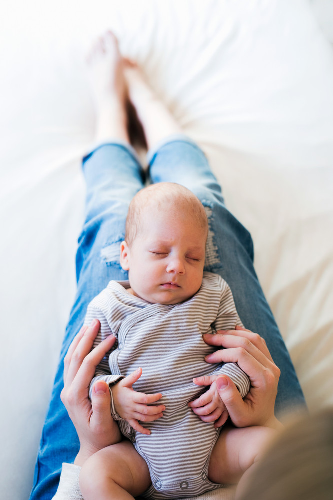 baby holding bed