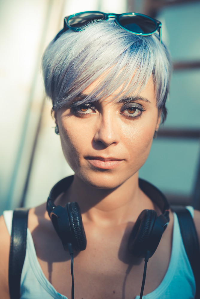 Young Beautiful Short Blue Hair Hipster Woman With Headphones