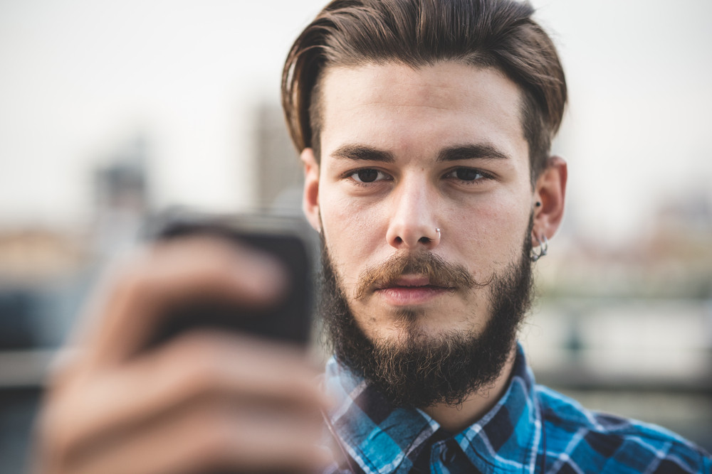Young Handsome Bearded Hipster Man Selfie In The City Royalty Free