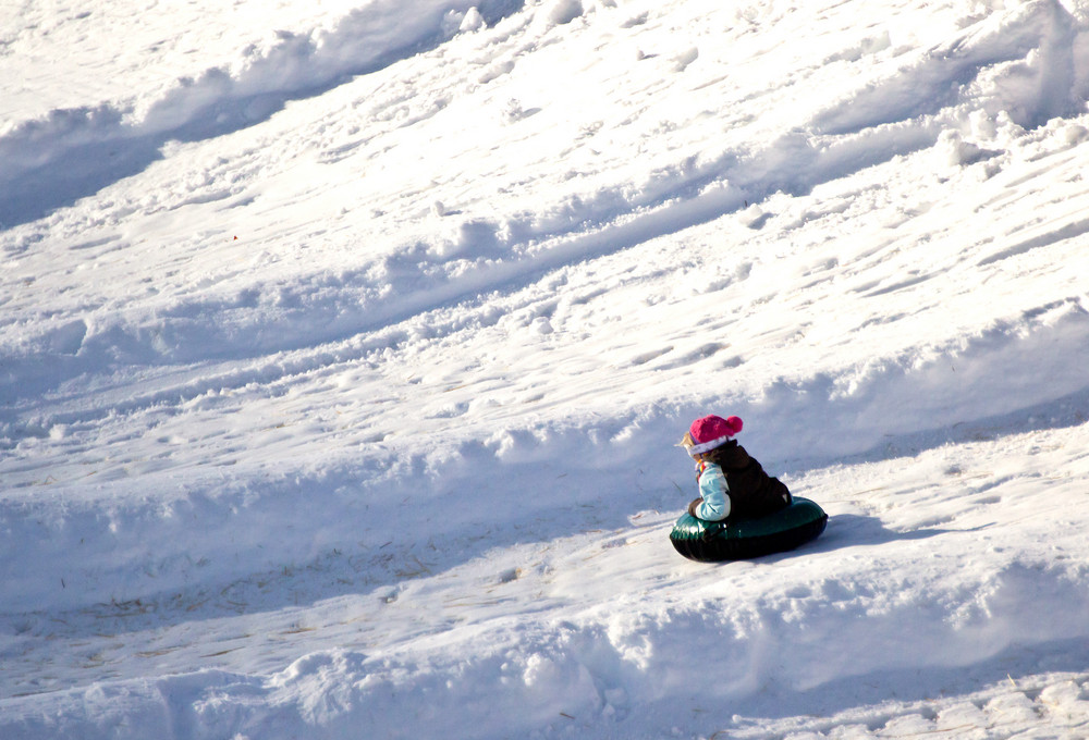 Kid Snow Tubing Royalty-Free Stock Image - Storyblocks