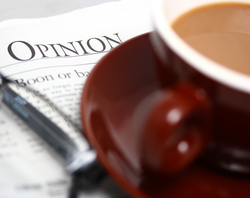 looking-at-the-opinion-section-of-a-newspaper-royalty-free-stock-image