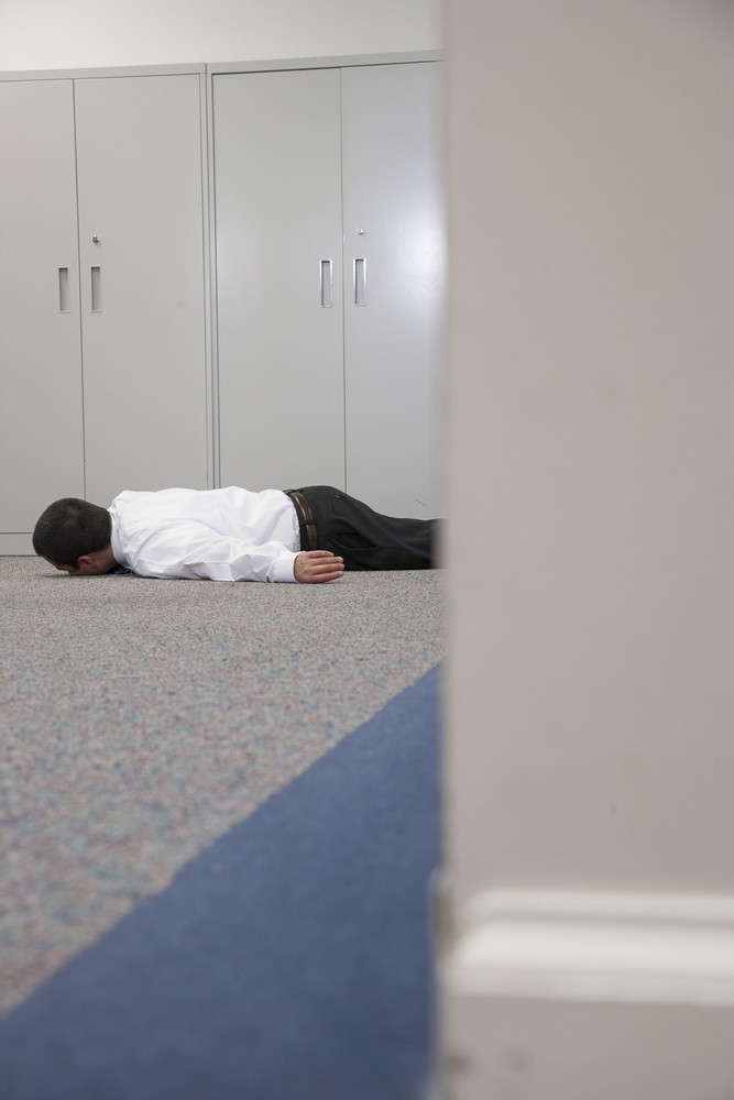 Man falling down in office