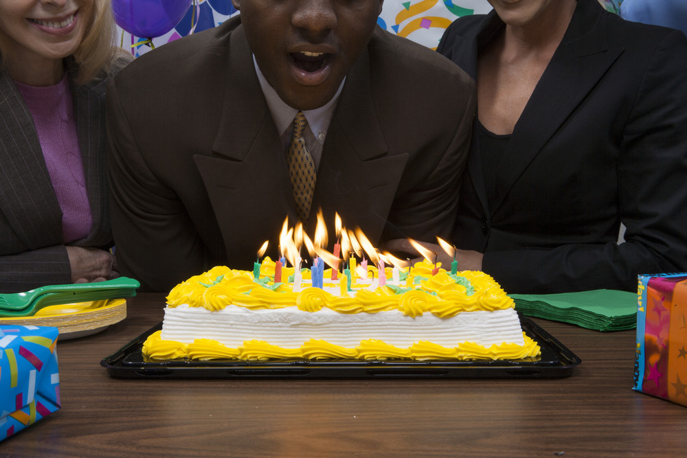 Office person with birthday cake
