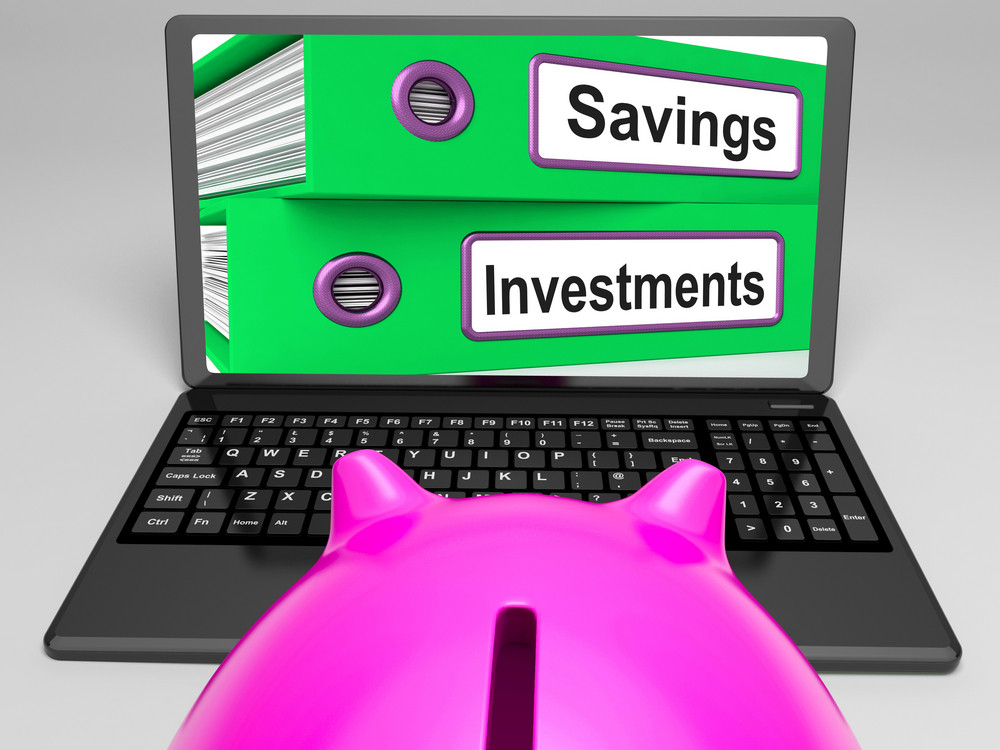 Savings And Investments Files On Laptop Showing Finances