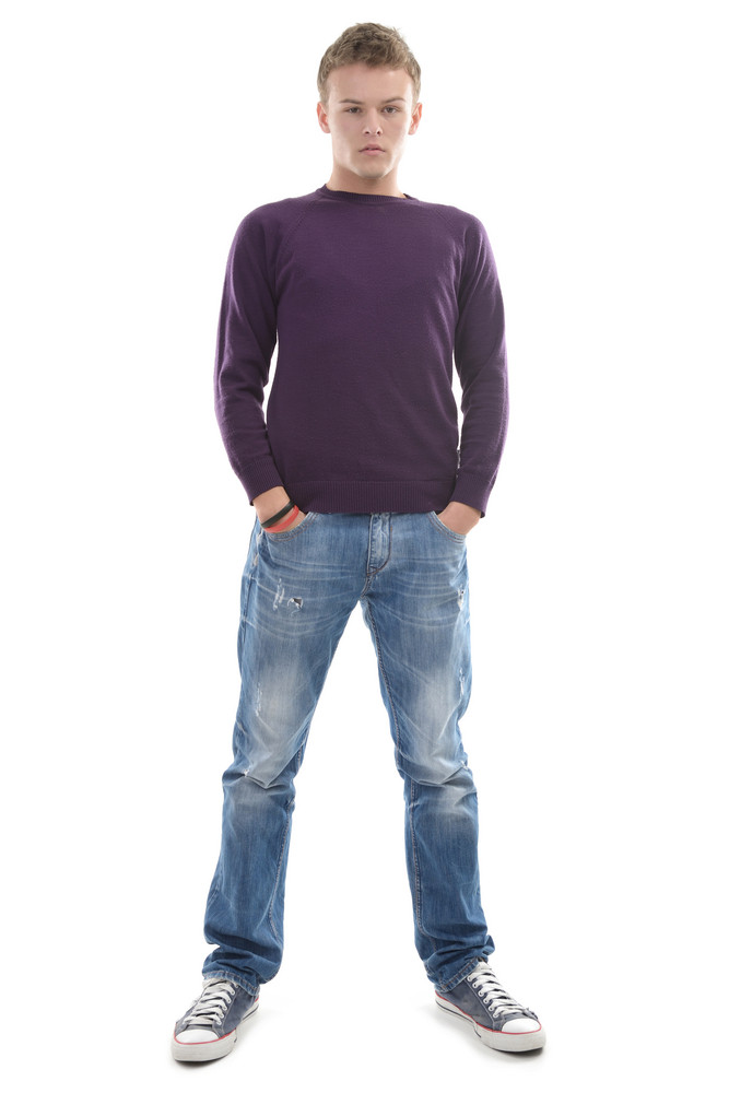 Young Man Standing On White Background With His Hands In His Pockets Royalty Free Stock Image