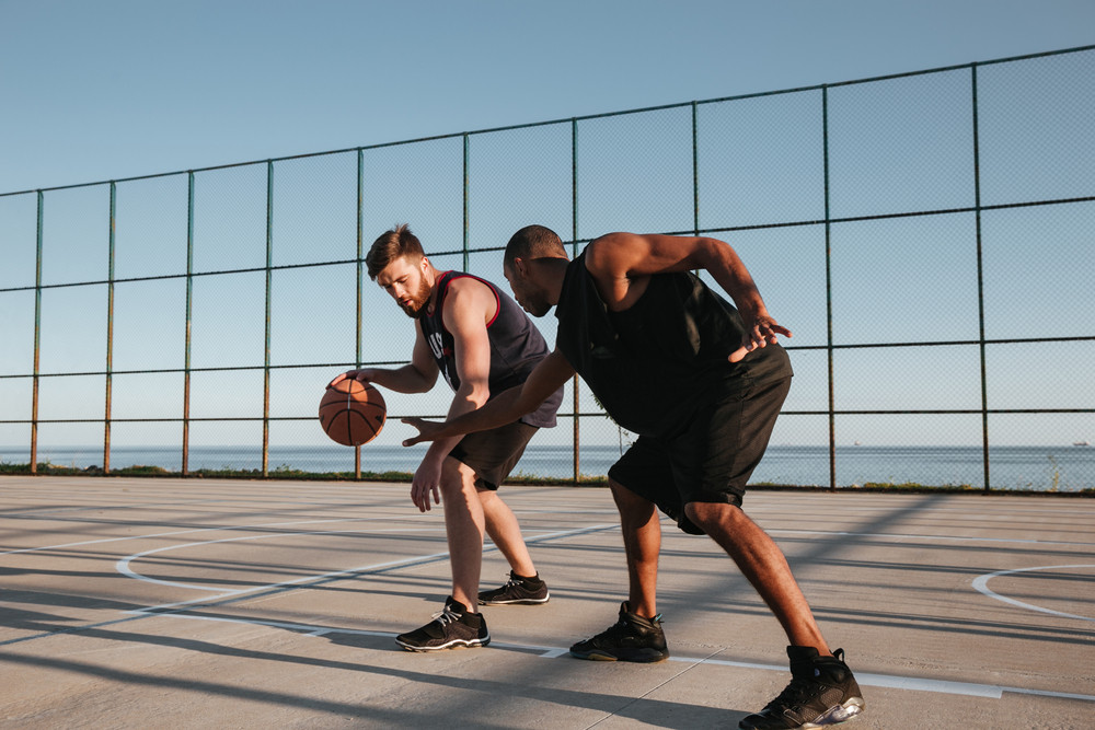 Two healthy basketball players at the playground outdoors Royalty-Free ...