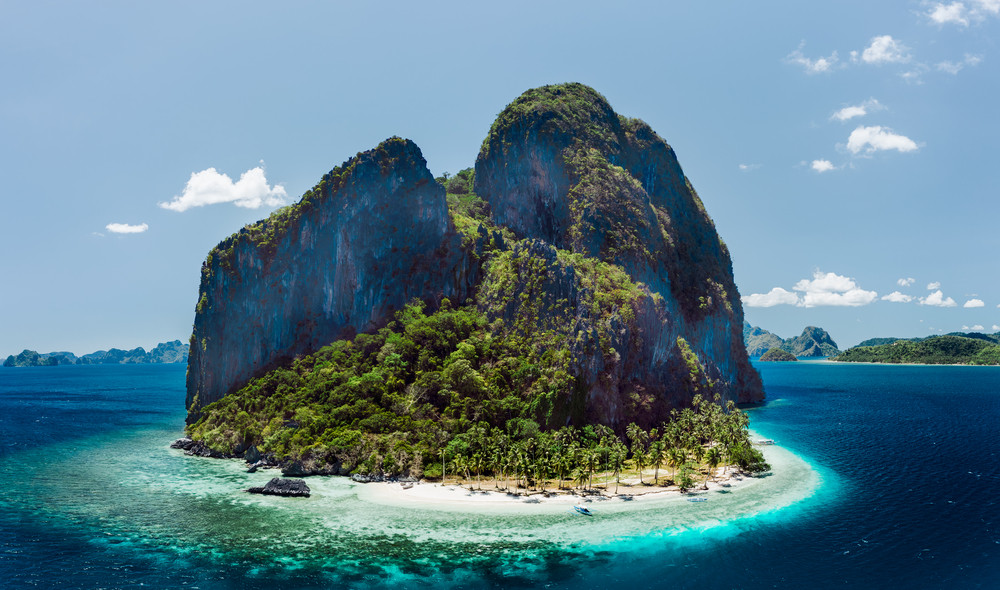 Aerial drone view of tropical Pinagbuyutan Island and ipil beach in blue ocean El Nido, Palawan, Philippines. Must see, most unique beautiful Enchanted Island